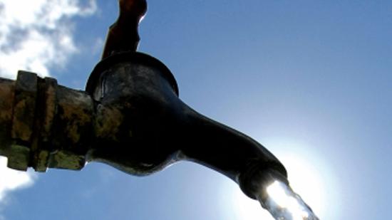 Faucet with water coming out of it.